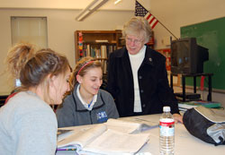 In her 56th year as an educator in the archdiocese, Benedictine Sister Louise Hoeing shares a moment with Holly Ackermann, left, and Amanda Sands, students at Bishop Chatard High School in Indianapolis. Sister&nbsp;Louise is the school&rsquo;s director of guidance. (Submitted photo) 
