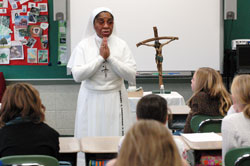 Daughters of Mary Mother of Mercy Sister&nbsp;Loretto Emenogu, a native of Nigeria, presents a mission talk to religious education students on Nov. 23, 2008, at St.&nbsp;Jude Parish in Indianapolis. Sister&nbsp;Loretto was named mission educator&nbsp;for the archdiocesan Mission Office on July 1, 2008, when Sister Demetria Smith, a Missionary Sister of Our Lady of Africa, retired. (Photo by Mary Ann Wyand) 