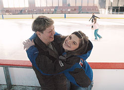 Katie Stamper, right, and her mother, Bernadette Reilly, share a moment of joy at the Pan American Plaza Skating Rink in Indianapolis. At 17, Katie is one of five Indiana athletes chosen to compete in the 2009 Special Olympics World Winter Games, an international competition featuring 3,000 athletes from 100&nbsp;countries that will begin on Feb. 7 in Boise, Idaho. Katie views her participation as part of God&rsquo;s plan for her. (Photo by John Shaughnessy) 