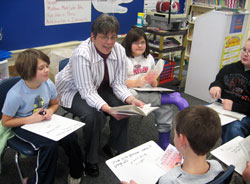 Eight teachers, Suzi Abell, Marsha Austin, Kathryn Jacobi, Sandi Kirchner, Donna Lathrop, Connie Schmidt, Jacque Singleton and Jackie Swihart, from across the&nbsp;archdiocese were recently recognized as winners of the Saint Theodora Excellence in Education Award. Above, Sandi Kirchner of St. Mary School in North&nbsp;Vernon teaches her third-grade students. On the day before she received her award, she stopped a car that veered out-of-control near the school. (Submitted photo) 