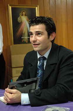 Internationally known author and speaker Tarek&nbsp;Saab of Fort&nbsp;Worth, Texas, signs copies of his book on March 4 at Our&nbsp;Lady of the Most Holy Rosary Parish in Indianapolis. Saab spoke to a capacity crowd attending the parish&rsquo;s &ldquo;Spaghetti and Spirituality&rdquo; Lenten adult education program. He is the co-founder of Lionheart Apparel, a Christian clothing company, and president of T. Saab Media Inc. (Photo by Mary Ann Wyand) 