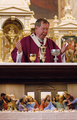 Archbishop Daniel M. Buechlein celebrates the eucharistic liturgy at the historic altar in the Old&nbsp;Cathedral Basilica of St. Francis Xavier in Vincennes, Ind., on March 18 during the archdiocesan jubilee pilgrimage. The altar features a depiction of the Last Supper. (Photo by Mary Ann Wyand) 