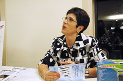 Catholic author and radio show host Teresa Tomeo of Detroit autographs a book after her keynote speech at the Catholic Radio 89.1 FM dinner on April 16 in Indianapolis. Tomeo collaborated on two books for Catholic teenagers, and also wrote books about the media influences on culture and the media&rsquo;s affect on her own life. (Photo by Mary Ann Wyand) 
