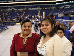 Lucy Rocha, left, and Mirna Catalan pose for a picture before the anniversary celebration. Rocha was the confirmation sponsor for Catalan, one of 35 Hispanics from Holy Spirit Parish in Indianapolis who were confirmed during the 175th&nbsp;anniversary Mass on May 3. (Photo by John Shaughnessy) 