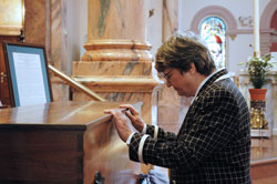 St. Joseph Sister Helen&nbsp;Prejean of New Orleans prays before the remains of St. Theodora Gu&eacute;rin on April&nbsp;13 at the Church of the Immaculate Conception at Saint Mary-of-the-Woods. Actress Susan Sarandon earned an Academy Award for her portrayal of Sister Helen in the 1996 movie version of her book, Dead Man Walking. The play by that name is now offered without charge to student groups to present on stage as an educational program. (Photo by Mary Ann Wyand) 