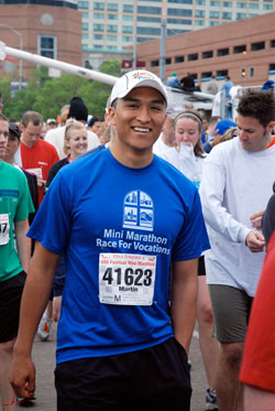 Seminarian Martin Rodriguez, a senior at Bishop Simon Brut&eacute; College Seminary and member of St. Mary Parish, both in Indianapolis, takes part in the One America 500 Festival Mini-Marathon on May 2. (Photo by Jessica Geisler) 