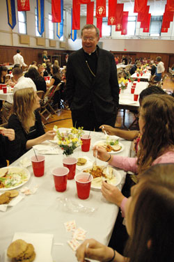 Archbishop Daniel M. Buechlein talks with &ldquo;A Promise to Keep&rdquo; chastity peer mentors during the annual recognition luncheon on April 23 at the Archbishop O&rsquo;Meara Catholic Center in Indianapolis. (Photo by Mary Ann Wyand) 