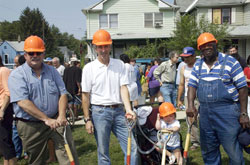 Lucious Newsom and Anna Molloy worked together for years to inspire people to care for the hungry and the needy. In this 2005&nbsp;photo, Lucious, right, and Anna, second from right, pose during a groundbreaking ceremony for Anna&rsquo;s House, a community service center in Indianapolis that was created to serve people in need. Charlie Caito, left, and Leo Stenz, two loyal supporters of Anna&rsquo;s House, participated in the groundbreaking ceremony. (Submitted photo) 