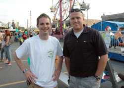 Holy Spirit parishioners Christopher Hess, left, and Justin Lawrence of Indianapolis pose for a photograph on July 9 at the parish festival. They helped three other men organize the summer festival this year in memory of their fathers, Richard &ldquo;Dick&rdquo; Hess and Donald &ldquo;Rex&rdquo; Lawrence, the longtime festival chairman and assistant chairman, who died earlier this year. Holy Spirit&rsquo;s festival, which dates back to 1948 as a small event, was expanded in 1954 and continues to grow larger each year. This year&rsquo;s festival attracted 10,000 people. (Photo by Mary Ann Wyand)