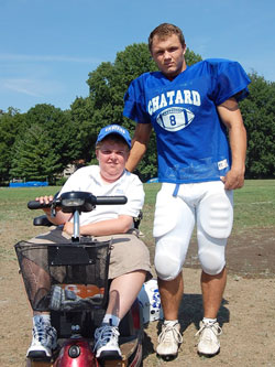Since their freshman year at Bishop Chatard High School in Indianapolis, Will Kuhn, left, and Mike Goetz have been good friends. The bond between the two seniors is just one of the many special relationships that have developed from Will becoming part of the school&rsquo;s football team as a manager, and being an inspiration as he moves forward through life despite muscular dystrophy. (Submitted photo by Kelly Lucas)