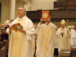 Father Todd Riebe processes into St. Mary Church in Richmond on Jan. 23, 2007, during a celebration of the canonization of St. Theodora Gu&eacute;rin. Father Riebe is the pastor of Holy Family, St. Andrew and St. Mary parishes, all in Richmond. (File photo by Sean Gallagher) 