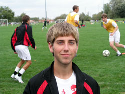 Reese Gillund poses on Sept. 28 at Lawrence Park in Indianapolis while his teammates on the boys&rsquo; soccer team of Cardinal Ritter Jr./Sr. High School in Indianapolis practice together. (Photo by John Shaughnessy) 
