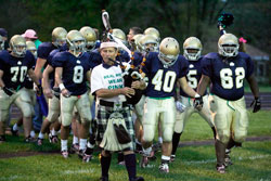 Cathedral High School football players run on to the field before their Oct. 23 game against Lebanon High School wearing pink shoelaces. The&nbsp;shoelaces were a symbolic gesture to support fellow student Alyssa&nbsp;O&rsquo;Malia&rsquo;s effort to raise funds and awareness about breast cancer, the disease that her mother, Debi, is battling. (Submitted photo) 