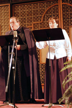 Priestly Fraternity of St. Peter Father Michael Magiera and high school teacher Ann Lewis perform together during a benefit for Lumen&nbsp;Christi Catholic School in Indianapolis on Oct. 7. (Submitted photo)