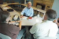 Deacon Steve Hodges, second from left, speaks with two members of the Indianapolis chapter of Courage, an apostolate that gives support to people who have same-sex attractions, but want to live chaste lives according to the Church&rsquo;s teachings on chastity and homosexuality. (Photo by Sean Gallagher)