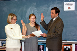 Clark Superior Court Judge Jerome Jacobi swears in Candace Popp, a sophomore at Our Lady of Providence Jr./Sr. High School in Clarksville, during a ceremony for students to adopt a snail in teacher Katie Aebersold&rsquo;s French class. Holding the Bible is Providence science teacher Ginger Shirley. (Submitted photo)