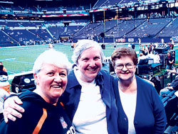 For 25 years, Providence Sister Jean Kenny, left, has predicted the outcome of the Super Bowl. This year, she predicts the Indianapolis Colts will beat the New Orleans Saints. Here she is pictured on Sept. 7, 2008, at Lucas Oil Stadium with two&nbsp;close friends from Indianapolis, Providence Sisters Barbara McClelland, center, and Rita Wade. (File photo)