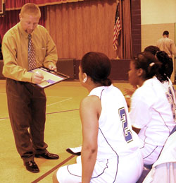 Coach Shane Tyree diagrams a play for members of the girls&rsquo; basketball team at Providence Cristo&nbsp;Rey High School in Indianapolis. In its third year in existence, Providence Cristo Rey continues to develop its sports program to give students the experience of learning life lessons from athletics. (Submitted photo)