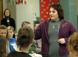 St. Bartholomew parishioner Kayla McClaine, a Columbus East High School senior, passes out pro-life literature to teenagers during &ldquo;Keep the Fire Burning,&rdquo; a pro-life rally she organized for her community service project. Kayla said she hopes the teenagers will share the pro-life information with other young people, which could help save the lives of unborn babies. (Photo by Mary Ann Wyand)