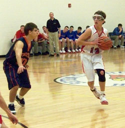 Seton Catholic High School basketball player Adam Schroeder directs his team&rsquo;s offense during a Feb. 19 game at Chuck Mosey Memorial Gymnasium in Richmond. In the past five years, Seton Catholic has made great strides in developing a sports program for its students. (Submitted photo)
