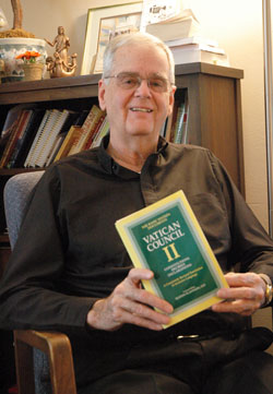 Father David Lawler, associate pastor of St. Christopher Parish in Indianapolis, holds a copy of the Second Vatican Council documents, which he often refers to while preparing his homilies. During 48&nbsp;years of priestly ministry, he has served at five parishes as well as at the state&rsquo;s largest hospital, where he enjoyed visiting the nursery to see the newborn babies. (Photo by Mary Ann Wyand)