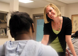 As the director of community and youth services at Holy Family Shelter in Indianapolis, Emily Able often brings a&nbsp;smile and caring touch to her efforts to help homeless children and their parents build a new life of hope. (Photo by John Shaughnessy)