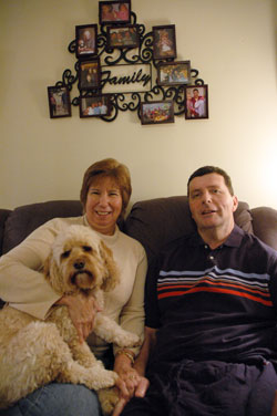 St. Thomas Aquinas parishioners Kathy and Bob Carroll of Indianapolis enjoy time together at home on March 25 with their dog, Emma. She is a registered nurse and one of the presenters for a caregivers retreat on April 22 at the Benedict&nbsp;Inn Retreat and Conference Center in Beech Grove. (Photo by Mary Ann Wyand)