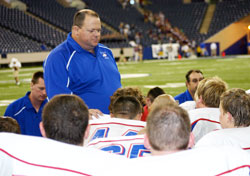 As the coordinator of youth ministry at St. Maurice Parish in Decatur County and chaplain of the North Decatur High School football team, Dave&nbsp;Gehrich is always searching for new ways to bring the message of Christ&rsquo;s life to teenagers, including football players. Gehrich is pictured here talking to the North Decatur team during their visit to the RCA Dome in Indianapolis for a game in 2007. (Submitted photo)