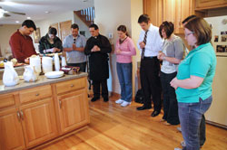 Young adults from New Albany Deanery parishes pray with Father Eric Augenstein, center, the pastor of Our&nbsp;Lady of Perpetual Help Parish in New Albany, during a &ldquo;Pasta with the Pastor&rdquo; gathering on March 26 at the parish rectory. He is 32. (Photo by Mary Ann Wyand)