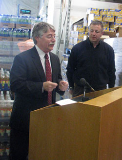 Indiana Attorney General Greg Zoeller, left, speaks at a March 16 news conference at the Terre&nbsp;Haute Catholic Charities Food Bank. John Etling, right, executive director of Catholic Charities Terre Haute, also participated at the gathering during which Zoeller announced the second annual &ldquo;March Against Hunger&rdquo; food drive. The initiative is a friendly competition among lawyers and law&nbsp;offices to raise the most donations for regional food banks that serve the hungry. (Photo courtesy of Indiana Attorney General&rsquo;s Office)