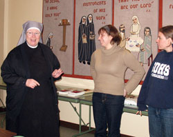 Sister Judith Meredith, left, the superior of the Little Sisters of the Poor in Indianapolis, speaks with Theresa Mills and Annie Girresch about her religious community on Feb. 27 at the order&rsquo;s St. Augustine Home for the Aged in Indianapolis. The visit was part of a &ldquo;nun run&rdquo; in which Mills, Girresch and three&nbsp;other women visited members of seven religious communities in Beech Grove and Indianapolis. The nun run was organized by the communities as a way to promote religious vocations. (Submitted photo)
