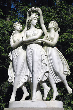 This Grecian sculpture of three women is among the ornate&nbsp;statues on the elegant and historic grounds of the Indianapolis Museum of Art adjacent to West 38th Street and Michigan Road in Indianapolis. (Photo by Mary Ann Wyand)