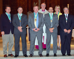 The 2010 St. John Bosco Award winners pose for a photograph with Msgr. Joseph F. Schaedel, vicar&nbsp;general, during the Catholic Youth Organization awards ceremony on May 4 at SS. Peter and Paul Cathedral in Indianapolis. They are, from left, front row, Mike Lewinski of St. Mark the Evangelist Parish, Jess Stump of St. Pius X Parish, Clay Courtney of St. Malachy Parish in Brownsburg, Jim&nbsp;Meiner of St. Lawrence Parish, and Tom Dale of St. Barnabas Parish. In the back row, with Msgr.&nbsp;Schaedel, is Joan Bartley of St. Jude Parish. (Submitted photo)