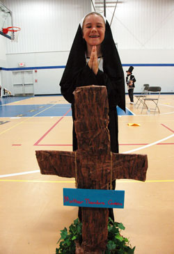 Fourth-grader Molly Habegger of Indianapolis poses as St. Theodore Gu&eacute;rin at the conclusion of St. Luke School&rsquo;s fourth annual fundraiser to benefit the Food Link, a poverty relief ministry in Marion County, on May 26. The students researched noteworthy people with past or present connections to Indiana then dressed in elaborate costumes and presented memorized speeches about their lives. (Photo by Mary Ann Wyand)