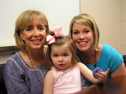 A first-grade teacher at St.&nbsp;Pius X School in Indianapolis, Jeanine&nbsp;Ritter, left, started an effort at the school to collect 1 million pop can tabs for the Ronald&nbsp;McDonald House in Indianapolis. The school reached its goal this spring. Ritter is shown with her niece, Katie&nbsp;Chamness, right, and Katie&rsquo;s daughter, Gabby. (Photo by John Shaughnessy)