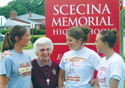 Franciscan Sister Lavonne Long&rsquo;s love of interacting with young people shines on her face. In this 2006 file photo, the then 84-year-old educator shares a laugh with, from left, Hannah Zimmerman, Jesse Wilson and Jessi Wright, students at Father Thomas Scecina Memorial High School in Indianapolis. (File photo by John Shaughnessy)