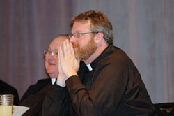 Father Eric Johnson, right, the archdiocesan director of vocations, and Msgr. Frederick Easton, vicar&nbsp;judicial of the archdiocesan Metropolitan Tribunal, enjoy a joke shared by retired Father Joseph Sheets during the Seymour Deanery&rsquo;s Clergy Appreciation Dinner on June 8 at St. Mary Parish in North Vernon. Father Johnson was the keynote speaker for the dinner sponsored by the Knights of Columbus to honor priests and deacons. (Photo by Mary Ann Wyand)