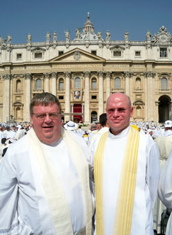 Father Robert Hausladen and Father Robert Robeson stand in St.&nbsp;Peter&rsquo;s Square in Rome on June 11 prior to Mass at which Pope&nbsp;Benedict XVI was the principal celebrant. They and some 15,000 other priests from 90 countries around the world concelebrated the Mass, which marked the end of the Year for Priests. Father Hausladen is the associate pastor of St. Pius X Parish and chaplain of Bishop Chatard High School, both in Indianapolis. Father Robeson is the rector of Bishop Simon Brut&eacute; College Seminary and provides sacramental assistance to St.&nbsp;Anthony and Holy Trinity parishes, all in Indianapolis. (Submitted photo)
