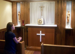 Jennifer Prickel prays in an adoration chapel at Holy Family Parish in Syracuse, N.Y., in June while visiting her twin brother, Andrew, who is a youth minister there. Jennifer recently received a gift of approximately $52,000 to pay off her student loan debt, which will allow her to enter the Steubenville, Ohio-based Sisters&nbsp;of Reparation to the Most Sacred Heart of Jesus in August. (Submitted photo)
