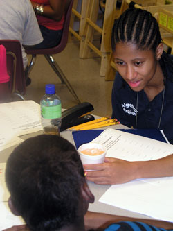 Making math fun for homeless children who temporarily live at Holy Family Shelter in Indianapolis is the goal of Lillian Sanders, a tutor for the Indianapolis Algebra Project and a junior at Marian&nbsp;University in Indianapolis. (Photo by John Shaughnessy)