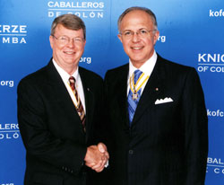 Charles Maurer, left, shakes hands with Carl&nbsp;Anderson, the supreme Knight of the Knights of Columbus, during a June meeting at the organization&rsquo;s headquarters in New&nbsp;Haven, Conn. Maurer, a member of St.&nbsp;Andrew Parish in Richmond, was recently appointed the Knights of Columbus&rsquo; supreme treasurer, one of its highest offices. (Submitted photo)