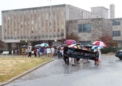 Determined pro-life supporters brave heavy rain as they begin the more than two-mile march from the St. Augustine Home for the Aged Chapel in Indianapolis to the Planned Parenthood abortion facility on Sept. 19 following the &ldquo;40 Days for Life&rdquo; opening prayer rally. (Submitted photo/Daniel Roy)