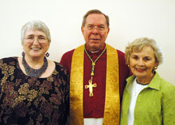 Becky Cope, left, and Mary Margaret Lynch, right, pose with Archbishop Daniel M. Buechlein on Sept.&nbsp;20 in the rectory of SS. Peter and Paul Cathedral in Indianapolis after the two lay ministers were honored for completing the archdiocese&rsquo;s Ecclesial Lay Ministry program. Cope ministers at Our Lady of the Greenwood Parish in Greenwood. Lynch ministers at St. Joseph Parish in Shelbyville. (Photo by Sean Gallagher)
