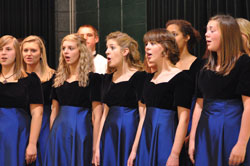 Choir members from Roncalli High School in Indianapolis sing during the 60th&nbsp;anniversary celebration for Our Lady of Fatima Retreat House on Oct. 23 at the Northside Knights of Columbus Hall in Indianapolis. Band members from Brebeuf&nbsp;Jesuit Preparatory School in Indianapolis also performed during the event. (Photos by Mary Ann Wyand)