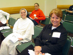 Dominican Sister Maria Fidelis Gray, left, the principal of Our&nbsp;Lady of Mt.&nbsp;Carmel School in Carmel,&nbsp;Ind., and Anne Dumas, the principal of St.&nbsp;Augustine School in Renssselaer, Ind., both in the Lafayette&nbsp;Diocese, gear up for a breakout session for administrators on Oct. 29. (Photo by Mary Banta)