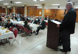 Msgr. Joseph F. Schaedel, vicar general, speaks to members of the board of trustees of the Catholic Community Foundation and other guests during the board&rsquo;s annual meeting on Nov. 10 at Our Lady of the&nbsp;Most Holy Rosary Parish in Indianapolis. The Catholic Community Foundation manages 381 endowments that support parishes, schools, agencies and other ministries across the archdiocese. (Photo by Sean Gallagher)