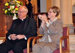 Msgr. Joseph F. Schaedel, left, and Annette &ldquo;Mickey&rdquo; Lentz, the archdiocesan chancellor, applaud as Bishop-designate Christopher J. Coyne is introduced during a Jan. 14 press conference at St. John the Evangelist Church in Indianapolis. Msgr. Schaedel will begin a three-month sabbatical in Rome in February. He has served as the vicar general of the archdiocese for 17 years, and also ministered as the pastor of Our Lady of the Most Holy Rosary Parish in Indianapolis. (Photo by Mary Ann Wyand)