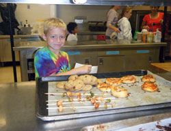 Clayton Phillip&rsquo;s smile shows how much fun the second-grade student at St.&nbsp;Mary&rsquo;s Catholic Academy in New Albany had during a Cooking with Math class, part of an innovative program at the school called Intensive Days. (Submitted photo)