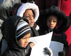 From left, Holy Angel Catholic School pre-kindergarten students Keirsyn Larsuel, Ashauntey Romain and De&rsquo;Yana Johnson bundle up for the cold as they participate in the school&rsquo;s march and program remembering the late Dr. Martin Luther King Jr. on Jan. 14. (Submitted photo)