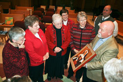 Paul Lunsford, the president of St. Theodore Gu&eacute;rin High School in Noblesville, Ind., in the Lafayette Diocese, right, talks about an icon of St. Theodora Gu&eacute;rin that the school presented to the Sisters of Providence of Saint Mary-of-the-Woods. Shown with Lunsford are, from left, Providence Sister Denise Wilkinson, the general superior of the order, and the general officers, Providence Sisters Paula Damiano, Marie McCarthy, Jane Marie Osterholt and Nancy Reynolds. (Submitted photo)